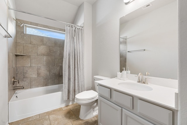 full bathroom featuring visible vents, toilet, shower / tub combo with curtain, stone finish floor, and vanity