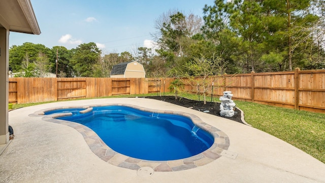 view of pool featuring a patio, a pool with connected hot tub, and a fenced backyard