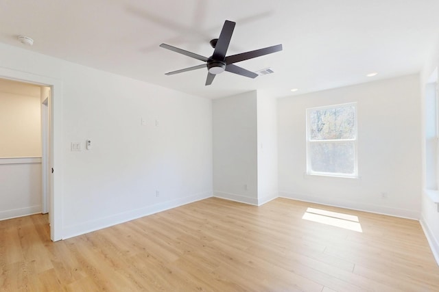 unfurnished room with visible vents, recessed lighting, light wood-style floors, and baseboards