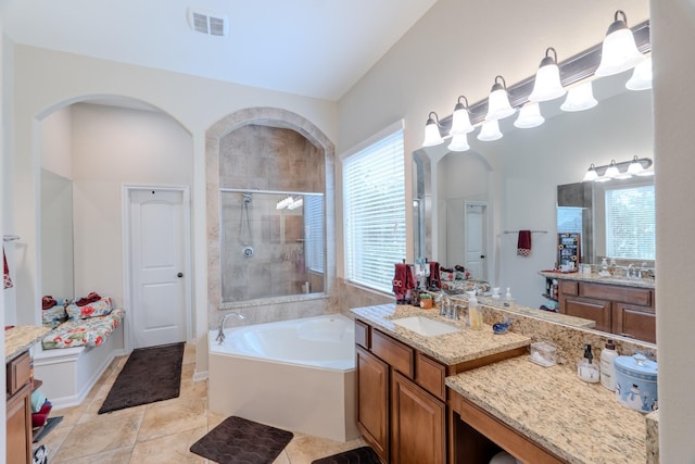 full bath with visible vents, tile patterned floors, a stall shower, a bath, and vanity