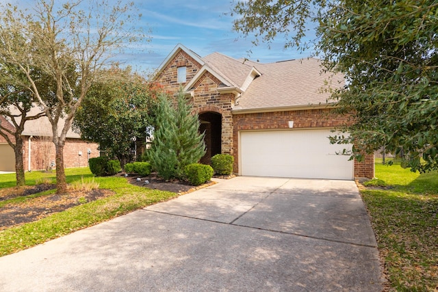 view of front of home featuring concrete driveway, an attached garage, brick siding, and a front lawn