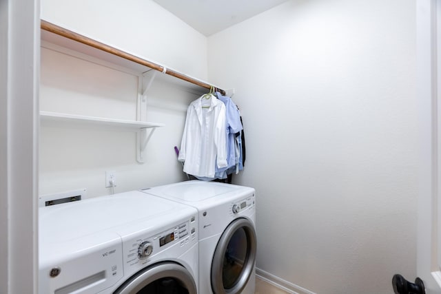 laundry area featuring independent washer and dryer and laundry area