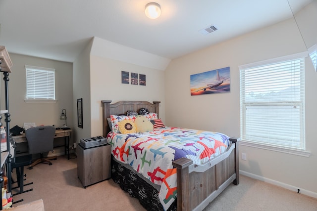 bedroom featuring visible vents, baseboards, and light colored carpet