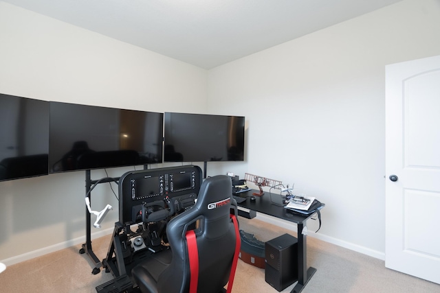 carpeted home office featuring baseboards