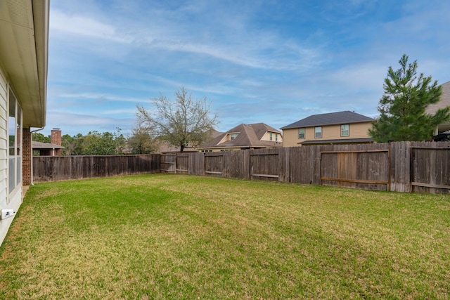 view of yard featuring a fenced backyard