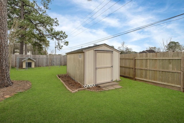 view of shed featuring a fenced backyard