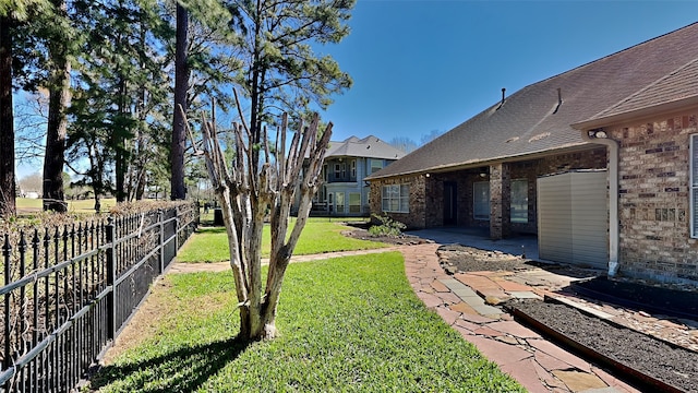 view of yard featuring a patio area and fence