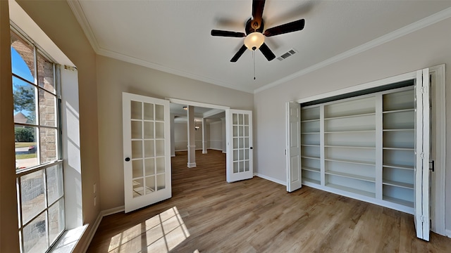 interior space featuring visible vents, french doors, and ceiling fan