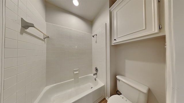 bathroom featuring toilet and bathtub / shower combination