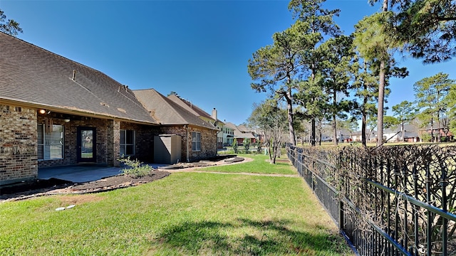 view of yard featuring a patio area and fence