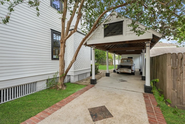1214 Heights Blvd, Houston, TX 77008 - view of vehicle parking featuring a carport, driveway, and fence