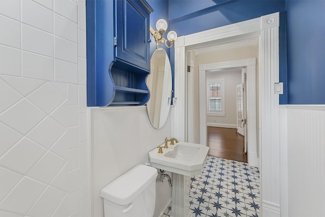 1214 Heights Blvd, Houston, TX 77008 - bathroom with a wainscoted wall, toilet, and a sink