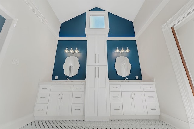 1214 Heights Blvd, Houston, TX 77008 - bathroom featuring baseboards, vanity, and vaulted ceiling