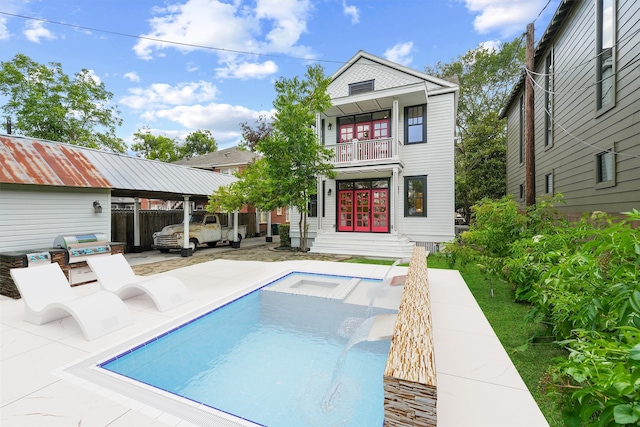 1214 Heights Blvd, Houston, TX 77008 - back of house featuring a patio, a balcony, and an outdoor pool