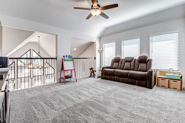 living room featuring lofted ceiling, carpet, and ceiling fan