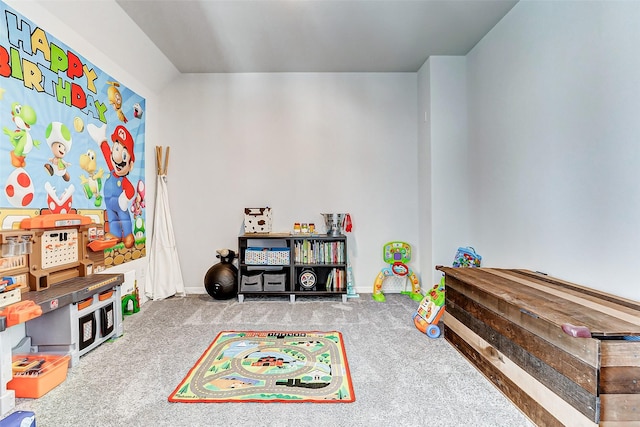 recreation room featuring carpet and baseboards