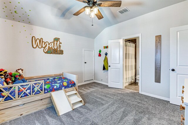 bedroom with visible vents, baseboards, carpet, and vaulted ceiling