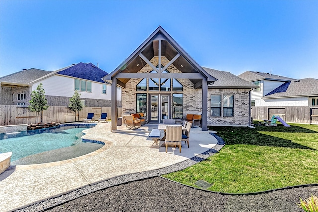 view of pool featuring a fenced backyard, a lawn, a patio, and a fenced in pool