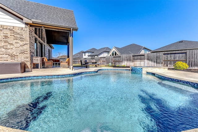 view of pool featuring cooling unit, a fenced in pool, a patio, and a fenced backyard