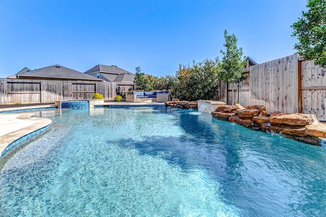 view of swimming pool with a fenced in pool and a fenced backyard