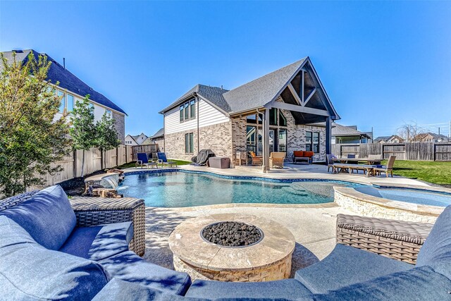 view of swimming pool with a fenced backyard, a fenced in pool, and a patio