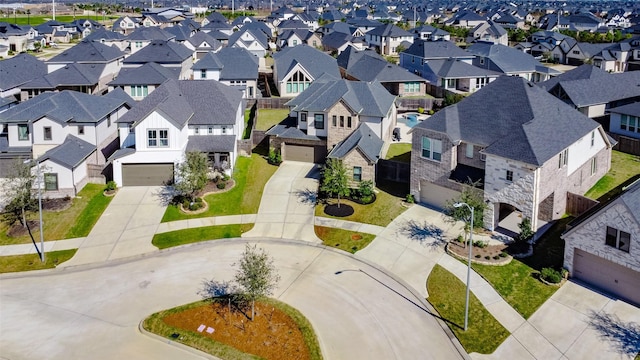 birds eye view of property with a residential view