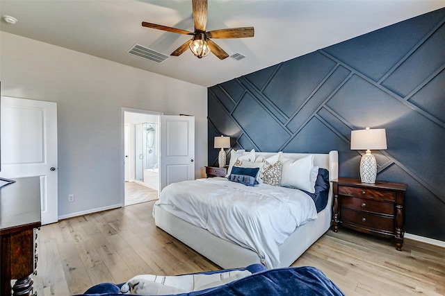 bedroom featuring visible vents, baseboards, and light wood-style floors