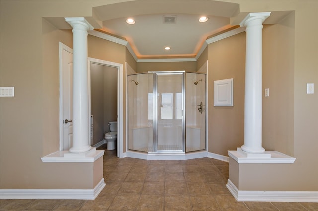 bathroom with visible vents, a stall shower, toilet, and ornate columns