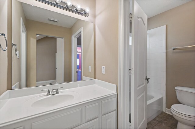 full bath featuring vanity, visible vents, tile patterned flooring, toilet, and shower / bathtub combination