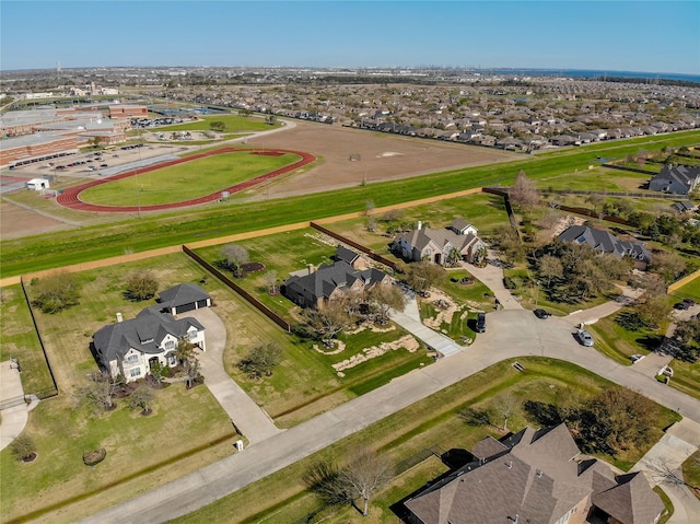 birds eye view of property with a residential view