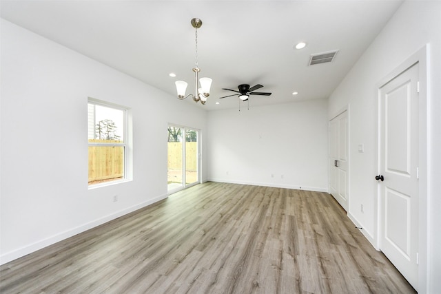 spare room with recessed lighting, visible vents, and baseboards