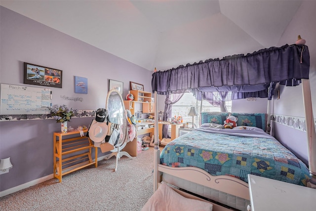 bedroom with carpet flooring, baseboards, and lofted ceiling