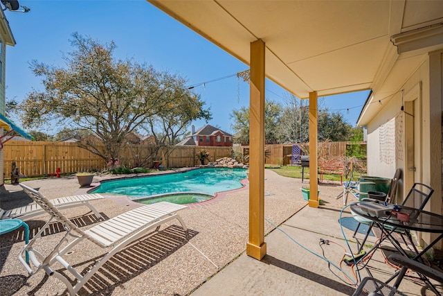 view of pool with a patio area, a fenced in pool, and a fenced backyard