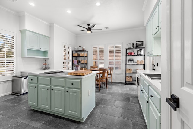 kitchen featuring recessed lighting, baseboards, and crown molding