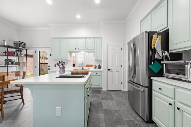 kitchen with a kitchen island, a toaster, light countertops, stainless steel refrigerator with ice dispenser, and crown molding