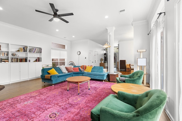 living area with visible vents, a ceiling fan, wood finished floors, recessed lighting, and crown molding