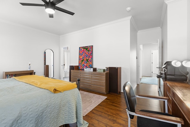 bedroom featuring dark wood finished floors, crown molding, baseboards, and ceiling fan