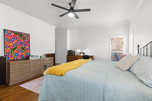 bedroom with a ceiling fan, dark wood-style flooring, and ornamental molding