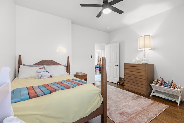 bedroom with a ceiling fan and wood finished floors