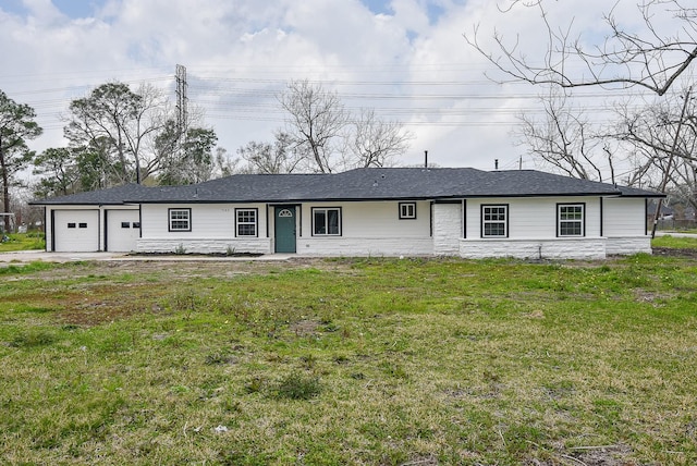 single story home with a front lawn and an attached garage