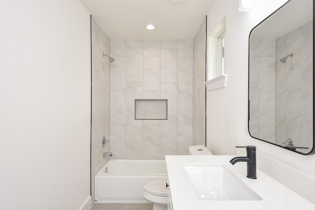 full bathroom featuring toilet, vanity, baseboards, and washtub / shower combination