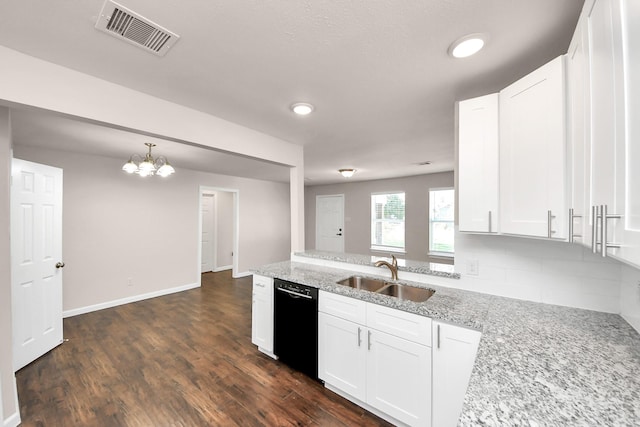 kitchen with visible vents, white cabinetry, dark wood-style flooring, a sink, and dishwasher