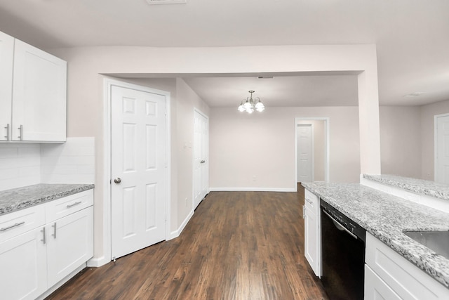 kitchen featuring dishwasher, white cabinets, light stone countertops, and backsplash