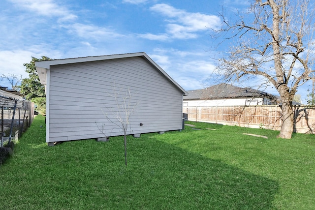 exterior space featuring an outbuilding and fence