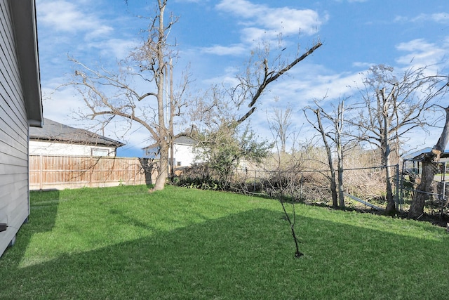 view of yard featuring fence