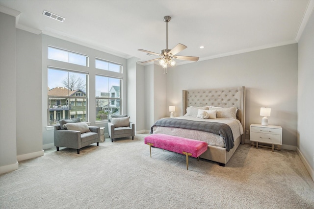 bedroom featuring visible vents, baseboards, carpet, and ornamental molding