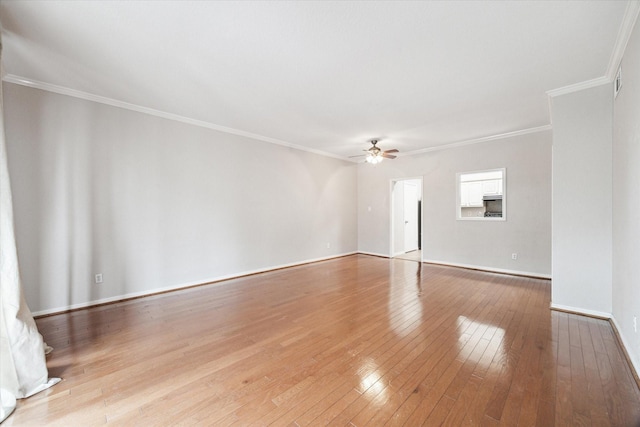 empty room featuring baseboards, a ceiling fan, crown molding, and light wood-style floors