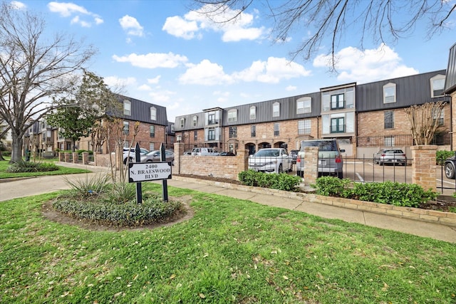 exterior space with a residential view and a yard