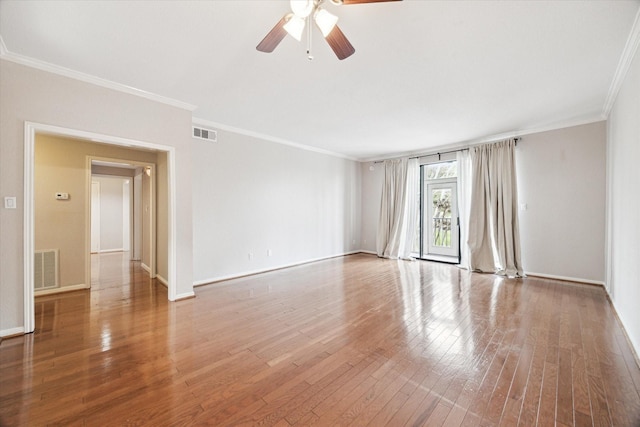 unfurnished room with ceiling fan, visible vents, wood-type flooring, and ornamental molding