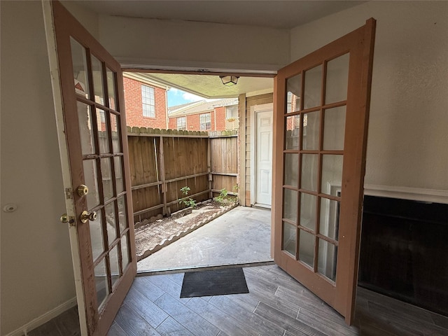 entryway featuring french doors and wood finished floors